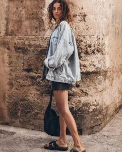 The Blue Oversized Denim Jacket 13 The Blue Oversized Denim Jacket -Modern Ladies Wear Store mikuta blue oversized denim jacket white loose linen t shirt black denim skirt black leather buckle sandals black relaxed raffia bag model aina 3641