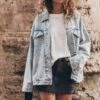 The Blue Oversized Denim Jacket 1 The Blue Oversized Denim Jacket -Modern Ladies Wear Store mikuta blue oversized denim jacket white loose linen t shirt black denim skirt model aina 3589
