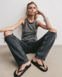 The Black Ripped Relaxed Jeans 8 The Black Ripped Relaxed Jeans -Modern Ladies Wear Store mikuta dark faded tank top black ripped relaxed jeans studded belt black studded leather sandals marie c SS25 1439