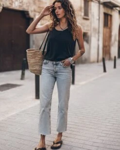 The Blue Cropped Straight Jeans 16 The Blue Cropped Straight Jeans -Modern Ladies Wear Store mikuta the blue cropped straight jeans the dark low back base tank top the black studded leather sandals the large raffia basket bag aina b SS25 8949