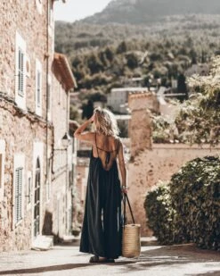 The Dark Flowy Jumpsuit 21 The Dark Flowy Jumpsuit -Modern Ladies Wear Store mikuta the dark flowy jumpsuit the black leather buckle sandals the large cesta bag 5066