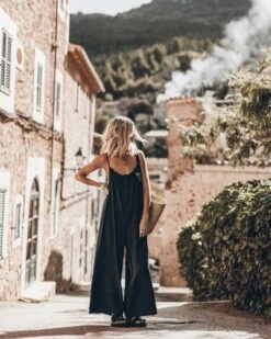 The Dark Flowy Jumpsuit 23 The Dark Flowy Jumpsuit -Modern Ladies Wear Store mikuta the dark flowy jumpsuit the black leather buckle sandals the large cesta bag 5556