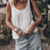 The White Linen Base Tank Top -Modern Ladies Wear Store mikuta the white linen base tank top the blue baggy jeans the black leather buckle sandals the small cesta bag 9477