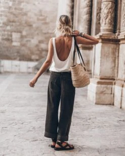 The White Low Back Base Tank Top 9 The White Low Back Base Tank Top -Modern Ladies Wear Store mikuta the white low back base tank top the black baggy jeans the studded belt the large cesta bag the black strappy leather sandals 9067